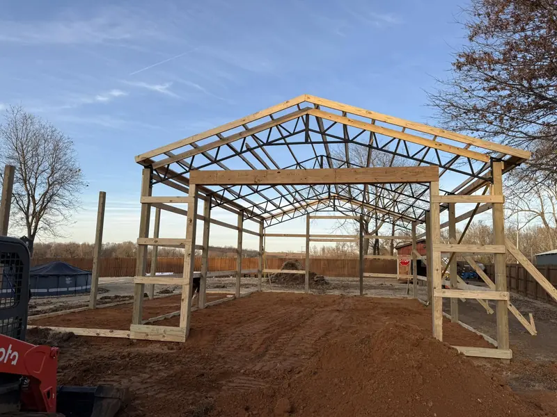 Pole barn frame under construction
