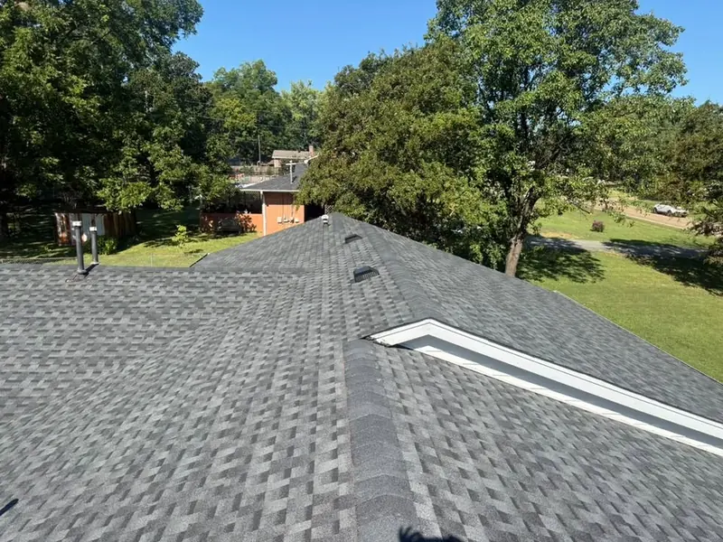 Gray shingle roof with a ridge vent