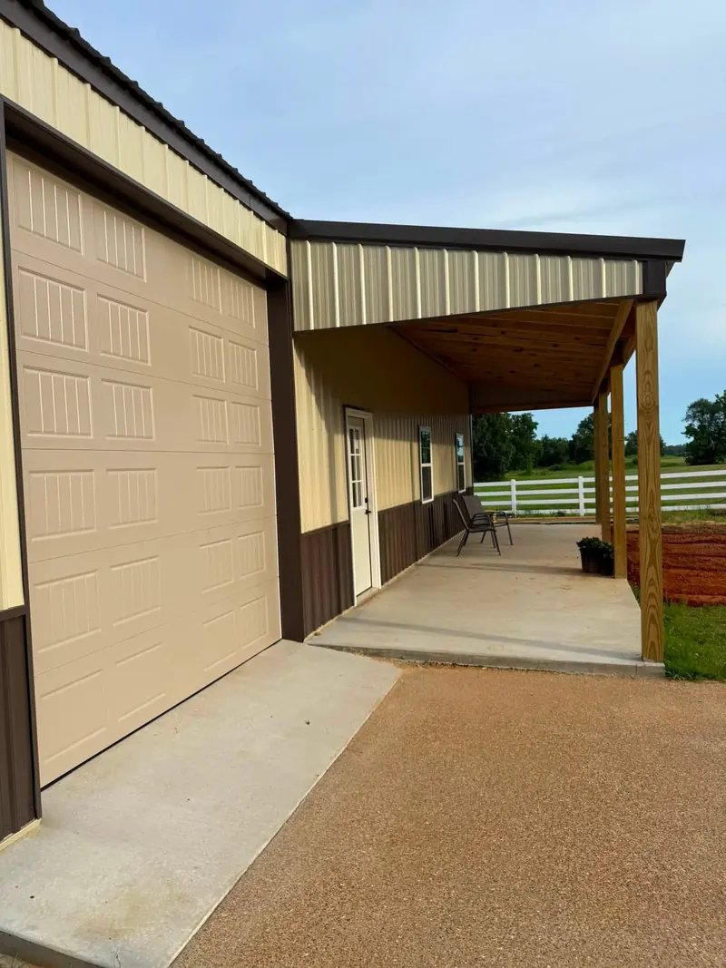 Tan metal building with covered porch