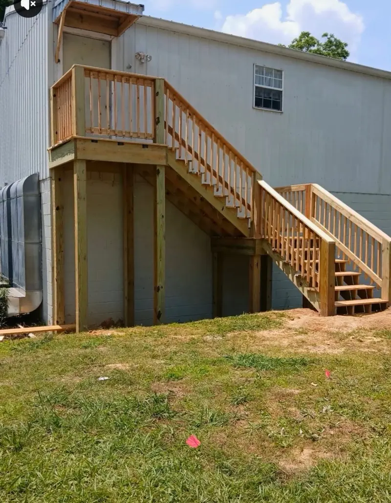 New wood stairs and landing to an upper-level door